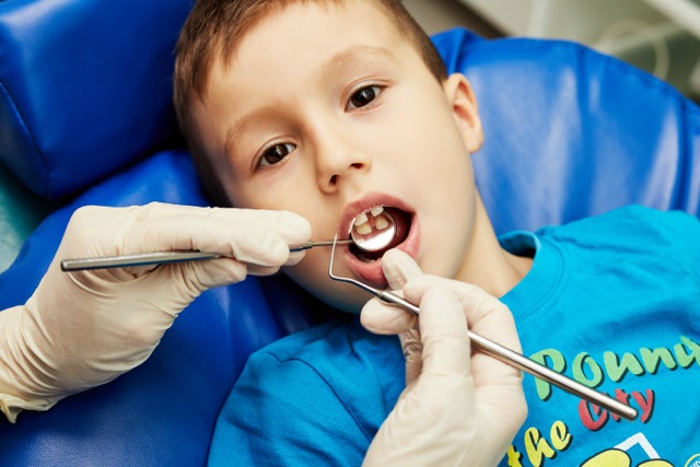 boy at pediatric dentist